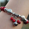 Tibetan silver fish and bell with red coral bracelet